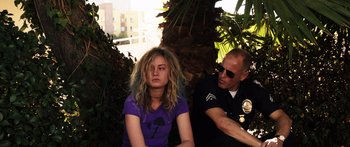 Movie still from “Rampart” (2011), directed by Oren Moverman – Medium shot, Over the shoulder angle