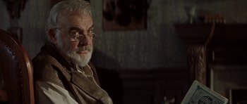 Movie still from “The League of Extraordinary Gentlemen” (2003), directed by Stephen Norrington – An older man with a beard and glasses; Close Up shot, Over the shoulder angle