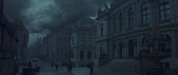 Movie still from “The League of Extraordinary Gentlemen” (2003), directed by Stephen Norrington – People walking down a street in a dark city; Extreme Wide shot, High angle