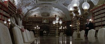Movie still from “The League of Extraordinary Gentlemen” (2003), directed by Stephen Norrington – A room filled with lots of bookshelves filled with lots of books; Wide shot, High angle