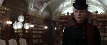Movie still from “The League of Extraordinary Gentlemen” (2003), directed by Stephen Norrington – A person wearing a mask in a room with bookshelves; Close Up shot, Low angle