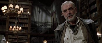 Movie still from “The League of Extraordinary Gentlemen” (2003), directed by Stephen Norrington – An older man with white hair standing in front of a staircase; Close Up shot, Low angle