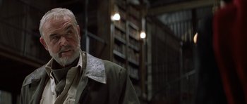 Movie still from “The League of Extraordinary Gentlemen” (2003), directed by Stephen Norrington – An older man wearing a jacket in a room with bookshelves; Close Up shot, Low angle