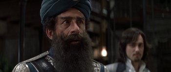 Movie still from “The League of Extraordinary Gentlemen” (2003), directed by Stephen Norrington – A man with a long beard wearing a blue turban; Close Up shot, Low angle