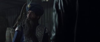 Movie still from “The League of Extraordinary Gentlemen” (2003), directed by Stephen Norrington – A man wearing a turban and a beard; Medium shot, Over the shoulder angle