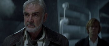 Movie still from “The League of Extraordinary Gentlemen” (2003), directed by Stephen Norrington – A man with white hair and a gray beard; Close Up shot, Over the shoulder angle