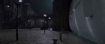 Movie still from “The League of Extraordinary Gentlemen” (2003), directed by Stephen Norrington – A street light in the middle of the night; Extreme Wide shot, High angle