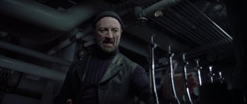 Movie still from “The League of Extraordinary Gentlemen” (2003), directed by Stephen Norrington – A man with a beard wearing a black hat and jacket; Medium shot, Low angle