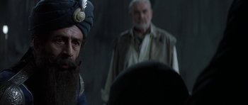 Movie still from “The League of Extraordinary Gentlemen” (2003), directed by Stephen Norrington – A man with a beard wearing a blue turban; Close Up shot, Over the shoulder angle