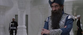 Movie still from “The League of Extraordinary Gentlemen” (2003), directed by Stephen Norrington – A man with a long beard wearing a turban; Medium shot, Low angle