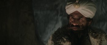 Movie still from “The League of Extraordinary Gentlemen” (2003), directed by Stephen Norrington – A man with a beard wearing a white turban; Close Up shot, Over the shoulder angle