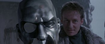 Movie still from “The League of Extraordinary Gentlemen” (2003), directed by Stephen Norrington – A man standing next to a metal head; Close Up shot, Low angle