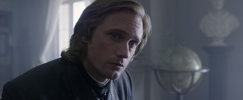 Movie still from “The Legend of Tarzan” (2016), directed by David Yates – A person with long blonde hair; Close Up shot, Over the shoulder angle