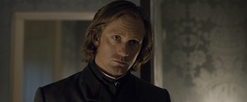 Movie still from “The Legend of Tarzan” (2016), directed by David Yates – A person with long hair; Close Up shot, Over the shoulder angle