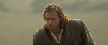 Movie still from “The Legend of Tarzan” (2016), directed by David Yates – A person with long hair; Close Up shot, Over the shoulder angle
