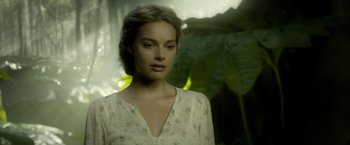 Movie still from “The Legend of Tarzan” (2016), directed by David Yates – A beautiful young lady wearing a white dress; Close Up shot, Over the shoulder angle