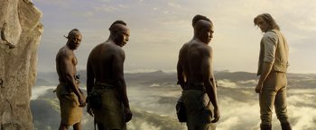 Movie still from “The Legend of Tarzan” (2016), directed by David Yates – A couple of men standing next to each other on top of a hill; Medium shot, Low angle