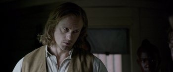 Movie still from “The Legend of Tarzan” (2016), directed by David Yates – A person with long hair; Close Up shot, Over the shoulder angle