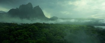 Movie still from “The Legend of Tarzan” (2016), directed by David Yates – A view of a forest with a mountain in the background; Extreme Wide shot, High angle