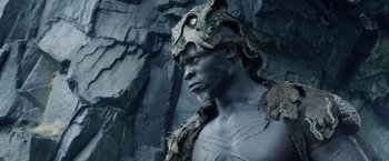 Movie still from “The Legend of Tarzan” (2016), directed by David Yates – A man with a mask on his head and face; Close Up shot, Low angle