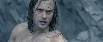 Movie still from “The Legend of Tarzan” (2016), directed by David Yates – A person with wet hair; Close Up shot, Over the shoulder angle