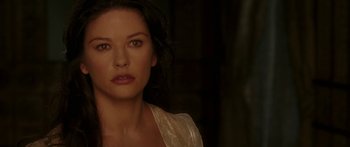 Movie still from “The Legend of Zorro” (2005), directed by Martin Campbell – A woman that is standing in the dark; Close Up shot, Over the shoulder angle