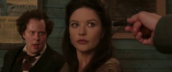 Movie still from “The Legend of Zorro” (2005), directed by Martin Campbell – A person with long black hair; Close Up shot, Over the shoulder angle