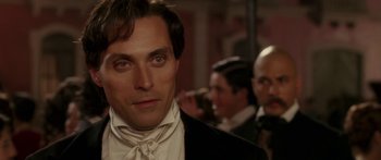 Movie still from “The Legend of Zorro” (2005), directed by Martin Campbell – A person wearing a suit and tie; Close Up shot, Over the shoulder angle