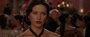 Movie still from “The Legend of Zorro” (2005), directed by Martin Campbell – A person wearing a necklace; Close Up shot, Over the shoulder angle