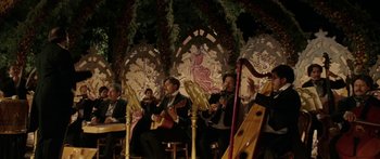 Movie still from “The Legend of Zorro” (2005), directed by Martin Campbell – A group of people playing instruments in a room; Wide shot, Low angle