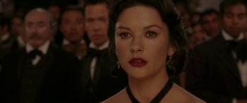 Movie still from “The Legend of Zorro” (2005), directed by Martin Campbell – A person wearing a necklace; Close Up shot, Over the shoulder angle