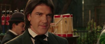 Movie still from “The Legend of Zorro” (2005), directed by Martin Campbell – A person wearing a suit and tie; Close Up shot, Over the shoulder angle