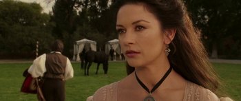 Movie still from “The Legend of Zorro” (2005), directed by Martin Campbell – A beautiful woman standing next to a horse in a field; Close Up shot, Over the shoulder angle