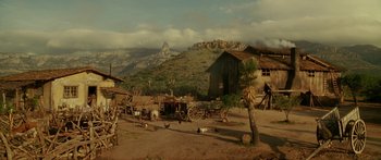 Movie still from “The Legend of Zorro” (2005), directed by Martin Campbell – An old western town with a horse drawn carriage; Extreme Wide shot, High angle
