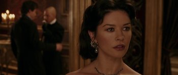 Movie still from “The Legend of Zorro” (2005), directed by Martin Campbell – A person wearing a necklace; Close Up shot, Over the shoulder angle