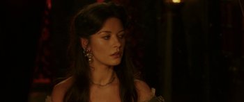 Movie still from “The Legend of Zorro” (2005), directed by Martin Campbell – A woman with long black hair wearing a necklace; Close Up shot, Over the shoulder angle