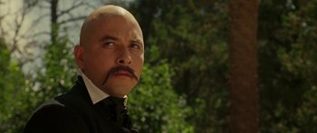 Movie still from “The Legend of Zorro” (2005), directed by Martin Campbell – A bald man with a mustache is looking upward; Close Up shot, Low angle