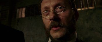 Movie still from “The Legend of Zorro” (2005), directed by Martin Campbell – A person wearing glasses and a beard; Close Up shot, Low angle