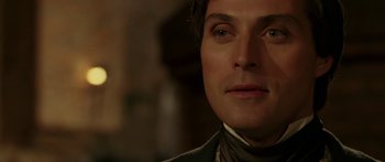 Movie still from “The Legend of Zorro” (2005), directed by Martin Campbell – A man's face in a dark room; Close Up shot, Over the shoulder angle