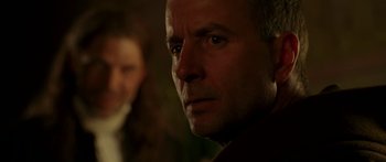 Movie still from “The Legend of Zorro” (2005), directed by Martin Campbell – A person's face in a dark room; Close Up shot, Over the shoulder angle