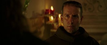 Movie still from “The Legend of Zorro” (2005), directed by Martin Campbell – A person wearing a monk's robe; Close Up shot, Over the shoulder angle