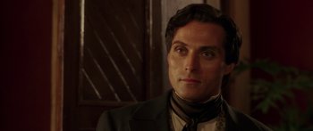 Movie still from “The Legend of Zorro” (2005), directed by Martin Campbell – A person wearing a suit and tie; Close Up shot, Over the shoulder angle