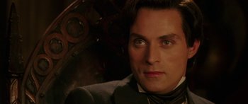 Movie still from “The Legend of Zorro” (2005), directed by Martin Campbell – A man's face in front of an engine of a car; Close Up shot, High angle