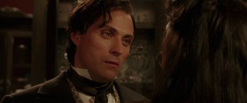 Movie still from “The Legend of Zorro” (2005), directed by Martin Campbell – A person wearing a suit and a tie; Close Up shot, Over the shoulder angle