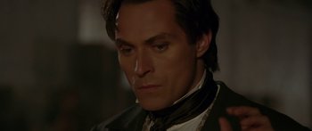 Movie still from “The Legend of Zorro” (2005), directed by Martin Campbell – A person wearing a suit and tie; Close Up shot, High angle