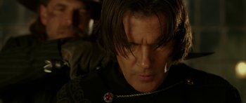 Movie still from “The Legend of Zorro” (2005), directed by Martin Campbell – A person with long dark hair; Close Up shot, Over the shoulder angle