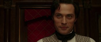 Movie still from “The Legend of Zorro” (2005), directed by Martin Campbell – A person wearing a suit and tie; Close Up shot, High angle