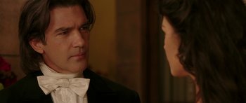 Movie still from “The Legend of Zorro” (2005), directed by Martin Campbell – A man and a woman in formal wear talking; Close Up shot, Over the shoulder angle