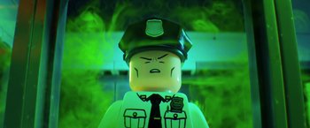 Movie still from “The Lego Batman Movie” (2017), directed by Chris McKay – A lego police officer's face; Close Up shot, Low angle