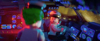 Movie still from “The Lego Batman Movie” (2017), directed by Chris McKay – A lego figure in the foreground; Close Up shot, Over the shoulder angle